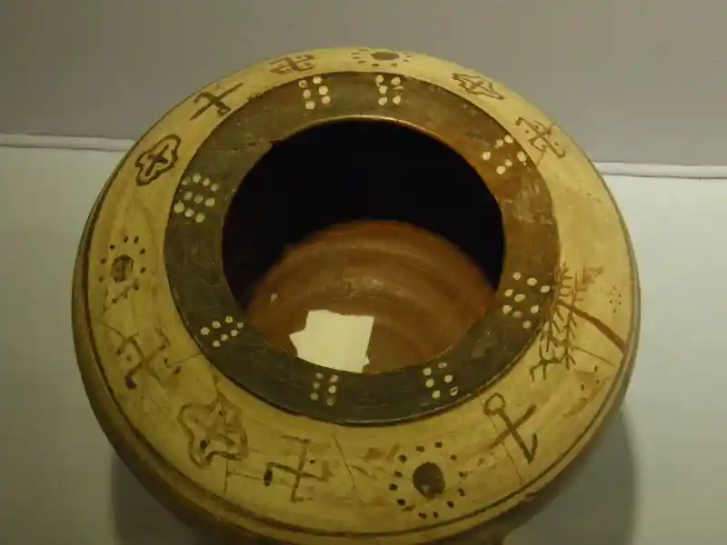 Crosses, sun rays and solar symbols on the mouth of a vase, located at Archaeological Museum of Izmir, Turkey